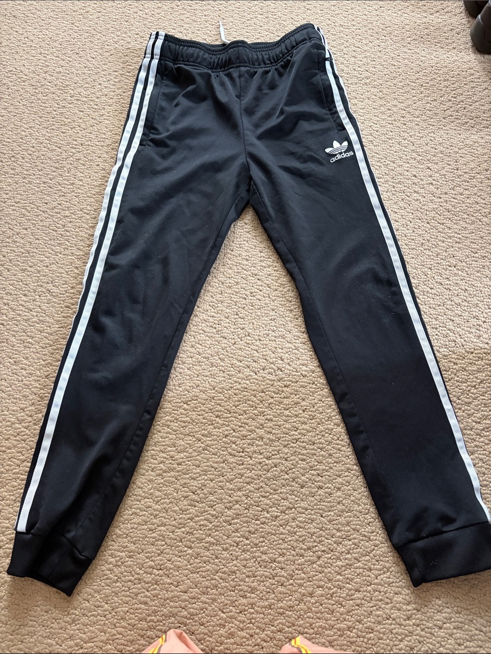 Adidas youth medium, black jogger pants with White Stripes
